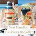 Orange & yellow floral print water bottle bags display a 40 ounce Owala FreeSip & a 30 ounce Stanley IceFlow Tumbler.